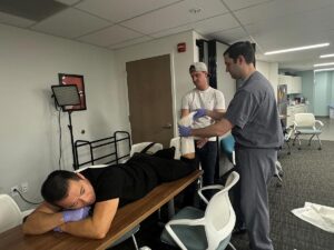 Drs. Chan, Liss, and Palmer demonstrating a procedure.